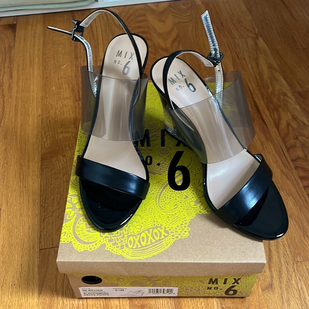 Brand new, never worn, ombré black/clear wedge heel.
